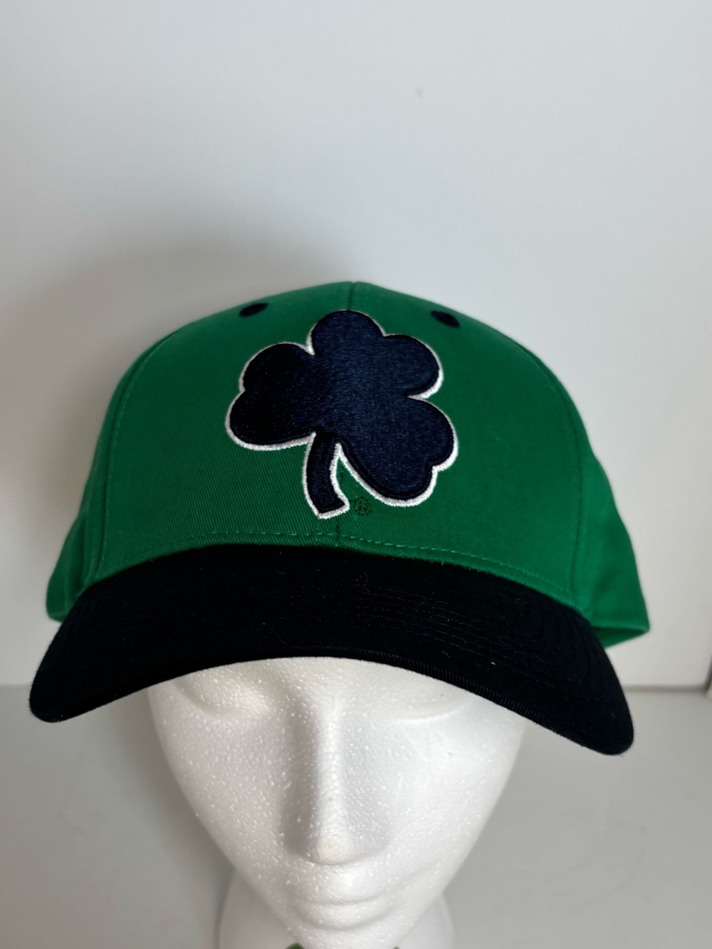 Green Notre Dame Irish cap with navy shamrock logo
